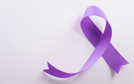 Purple ribbon on white background for supporting World Cancer Day campaign on February 4.の写真素材