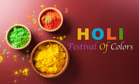 Happy Holi decoration, the indian festival.Top view of colorful holi powder on dark background.の写真素材