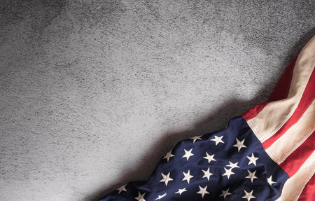 Happy memorial day concept made from American flag on dark stone background.