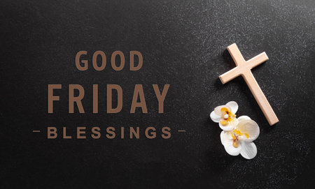 Good Friday and Holy week concept - A religious cross and flower on dark stone background.の写真素材