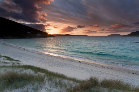 Sunrise on a scottish beach . Isle of Vatersay, Outer Hebrides of Scotland .の写真素材