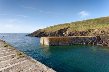 Porthgain harbour entrance, Pembrokeshire, Walesの写真素材