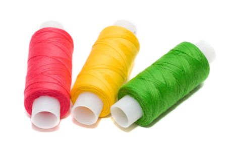 Coils of colour threads isolated on white