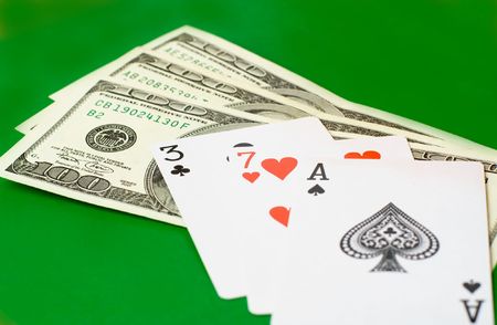 cards and money on a green clothのeditorial素材