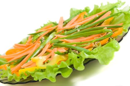 fresh vegetable salad on dish. isolated on whiteの写真素材