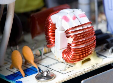 macro detail of inductor with red wireの写真素材