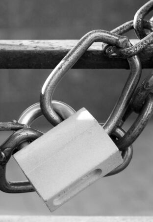 closed lock and chain on grating