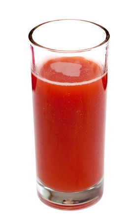 Tomato juice in clear glass isolated on white backgroundの写真素材