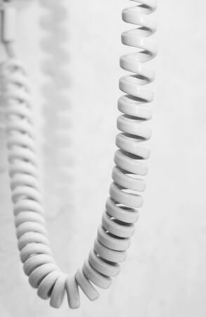 Telephone cable over grey backgroundの写真素材