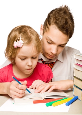 boy and girl reading a book. isolated on white backgroundの写真素材