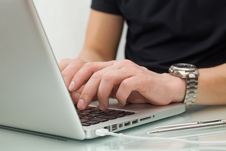 Businessman typing on a notebook の写真素材