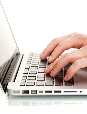 Writing on a white laptotの写真素材