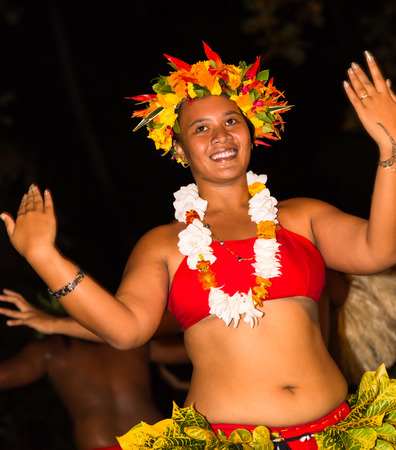 TAHAA, FRENCH POLYNESIA - CIRCA 2014: Polynesian men and women perform traditional dance circa 2014 in Tahaa.Polynesian dances are major tourist attraction of luxury resorts of French Polynesia.のeditorial素材