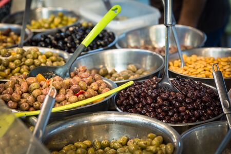 Pickled olive assortment on farmers market stallの写真素材
