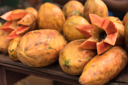 Fresh fruits of Papaya for sale laying on farm market stalls in Caribbeansの写真素材