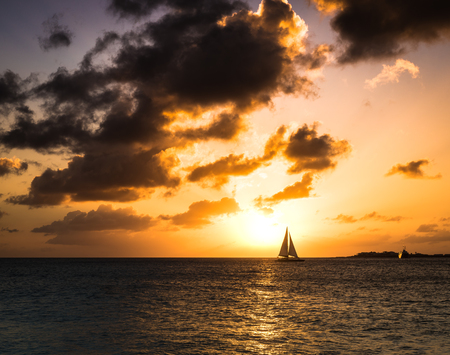 Silhouette of the distant boat on the horizonの写真素材