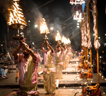 Group of priests performing Aarti - Hindu religious ritual