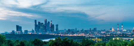City skyline with skyscrapers in Moscow city center at nightの写真素材