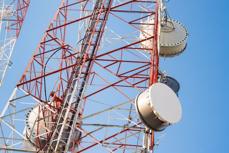 Satellite dish telecom tower on blue sky background