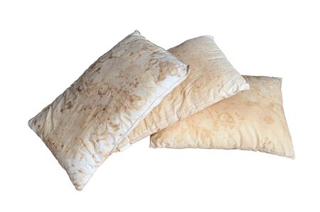 Old dirty pillow with saliva stain and fungus cause of illness, isolated white backgroundの写真素材