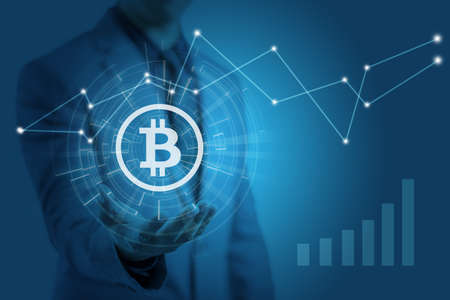 Businessman is showing bitcoin graphic symbol on hands with price increasing, concept of profit investment in digital assetの写真素材