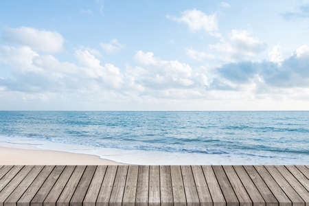 Wooden walkway with beautiful white sand beach ocean and clear blue sky background, space for product or object presentationの写真素材