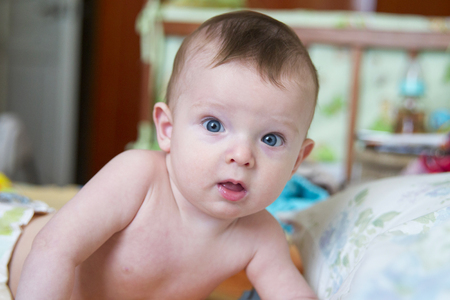 baby on the bed in her roomの写真素材
