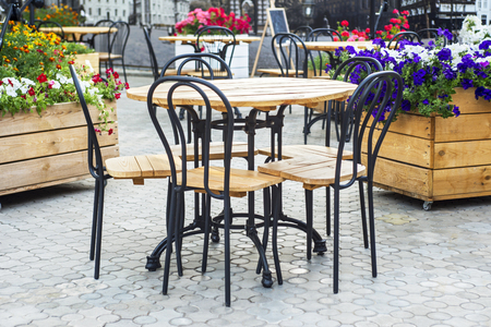 Cafe with tables and chairs in streetの写真素材