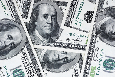 One hundred dollars pile as background. Cash of hundred dollar bills, dollar background image with high resolutionの写真素材