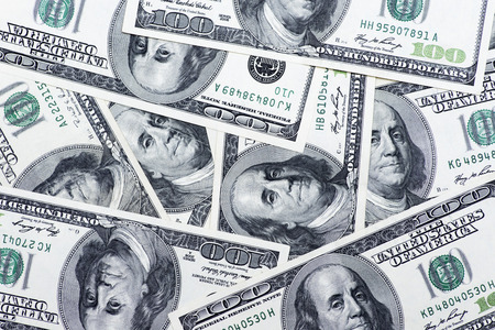 One hundred dollars pile as background. Cash of hundred dollar bills, dollar background image with high resolutionの写真素材