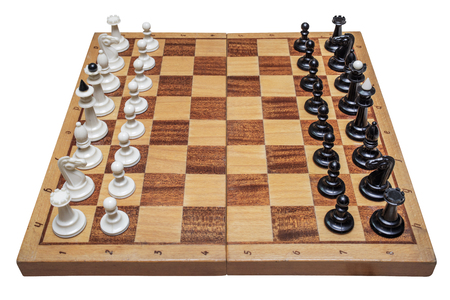 Chess pieces placed on chessboard isolated on white background. Chess on board isolated on white backgroundの写真素材