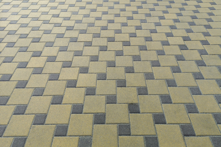 Cement brick floor background,patterned paving tiles.Brick paving stones on a sidewalk. Pavement in the cityの写真素材