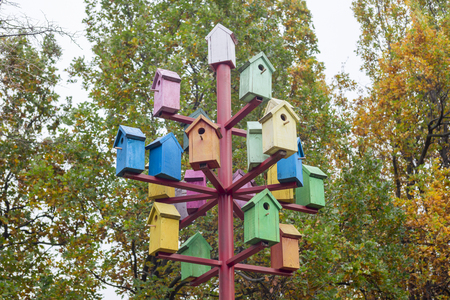A lot of colorful birdhouses. Colorful birdhouses in the park. Life in the neighborhood. Nesting seasonの写真素材