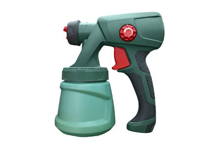 Spray gun for painting a hand-held electric tool. Industrial spray gun for painting isolated on white background. The tool for a painting of surfaces - spray gunの写真素材