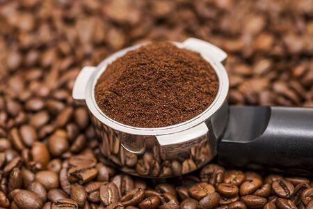 Coffee beans and portafilter. Filter holder for espresso coffee machine and coffee beansの写真素材