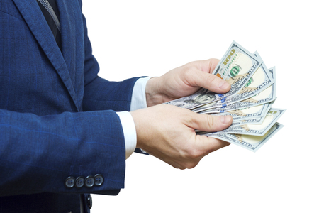 Detail of man hands with money. Hand recount dollars. Man counts the money. New hundred-dollar billsの写真素材