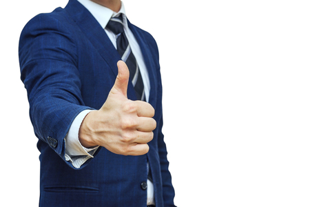 Businessman shows thumb up sign gesture. Nonverbal communication. Like, OK, perfect, good job, praise, satisfied, thumb up gesture of businessmanの写真素材