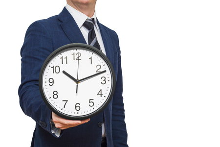 Clock in businessman hand. Businessman with a clock in a hand. Businessman with clock in time conceptの写真素材