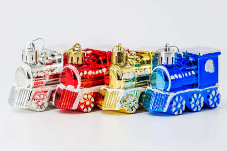 Christmas tree toys in the form of a train on white background. Christmas decorations.の写真素材