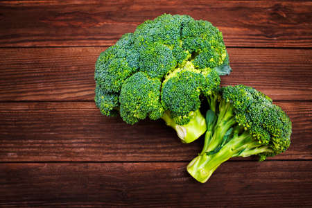 Fresh green broccoli on wooden background. Fresh broccoli on a wooden table.の写真素材