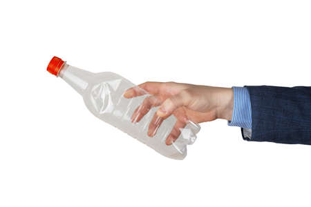 Man's hand holds a plastic bottle on a white isolated background. The concept of separate trash,...