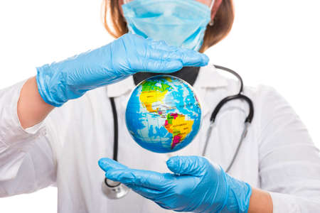 Female doctor protects planet Earth with her own hands. Concept of world health.