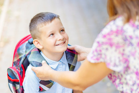 Back to school. Schoolboy is ready go to school. Cute child with a backpackの写真素材