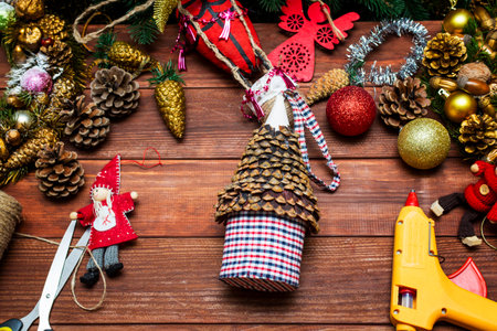 Workplace for creating New years toys and decorations on wooden backgroundの写真素材