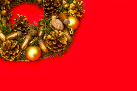 Christmas wreath with ornaments on red background. Christmas wreathの写真素材