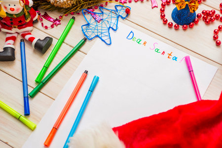 Child letter to Santa Claus with Christmas decorations and felt-tip pensの写真素材