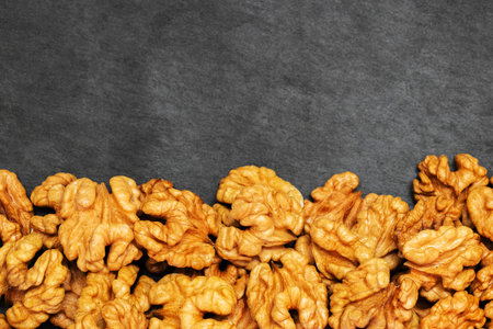 Walnuts. Walnut kernels on dark stone table. Top viewの写真素材