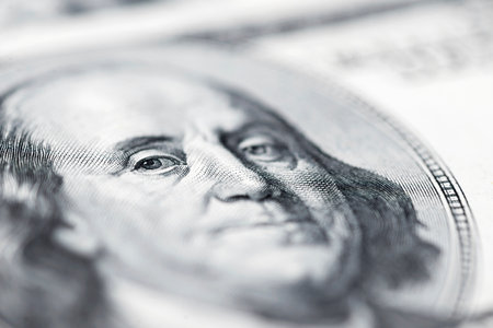 The face of Benjamin Franklin on the hundred dollar banknote, backgroundsの写真素材