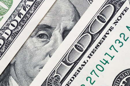 Benjamin Franklins eyes from a hundred-dollar bill. 100 dollar bill