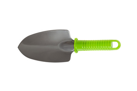 Garden tools. Small garden shovel with green handle isolated on white backgroundの写真素材
